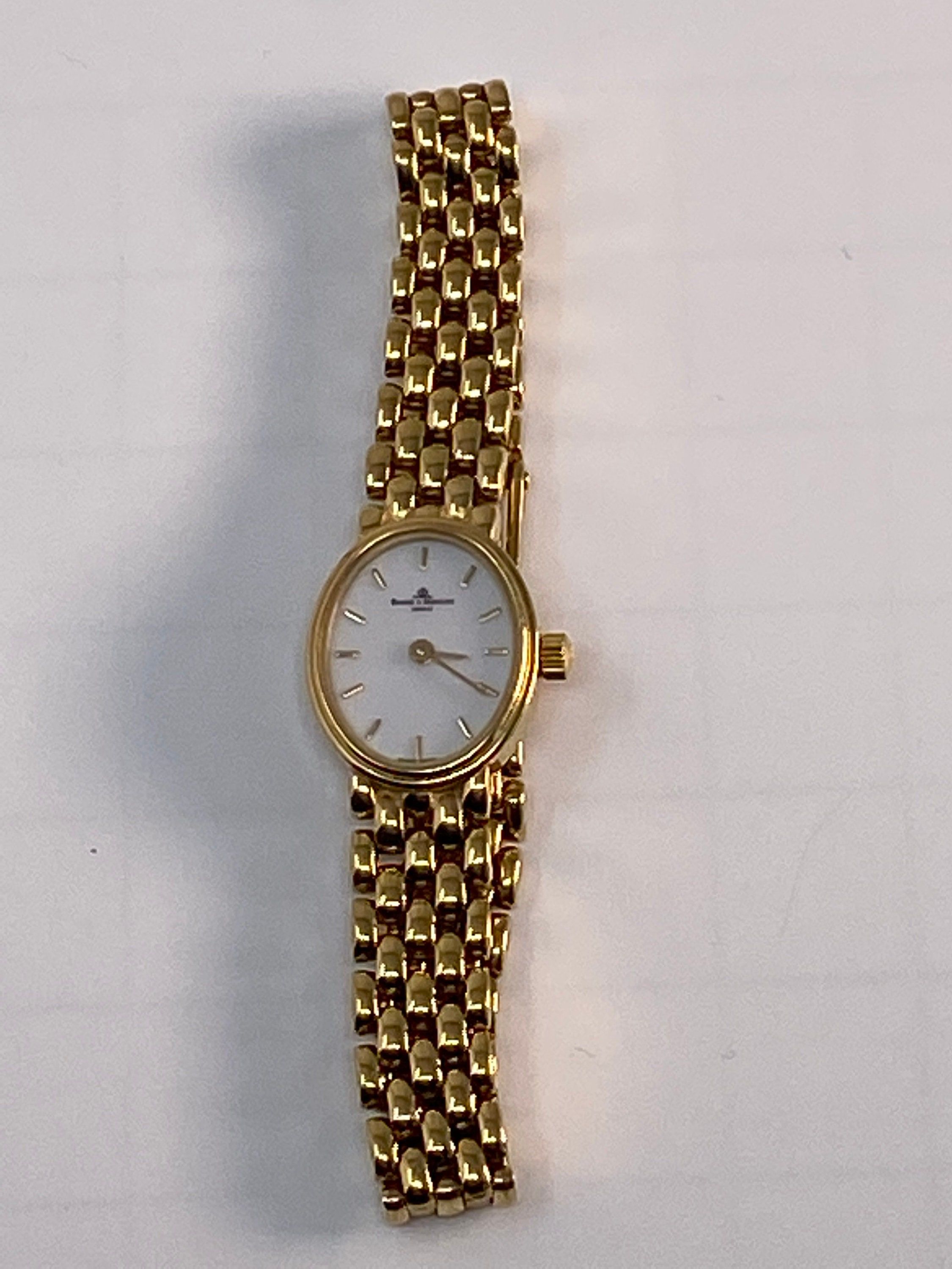 Vintage 14Kt  Yellow Gold Swiss BAUME MERCIER GENEVE Quartz Ladies Working Wrist Watch with a Professional 6,000.00 appraisal.